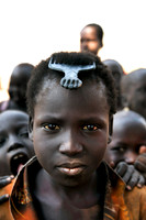 South Sudanese girl with a comb, her only possession